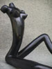 Female, black, sitting, piece no. 2. Partial.