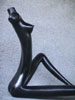 Female, black, sitting, piece no. 2. Partial.